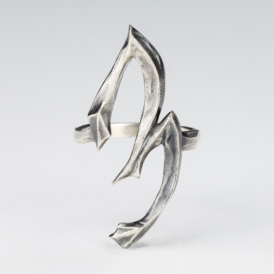 Gothic silver ring shaped as the number 3, handcrafted in 925 sterling silver.