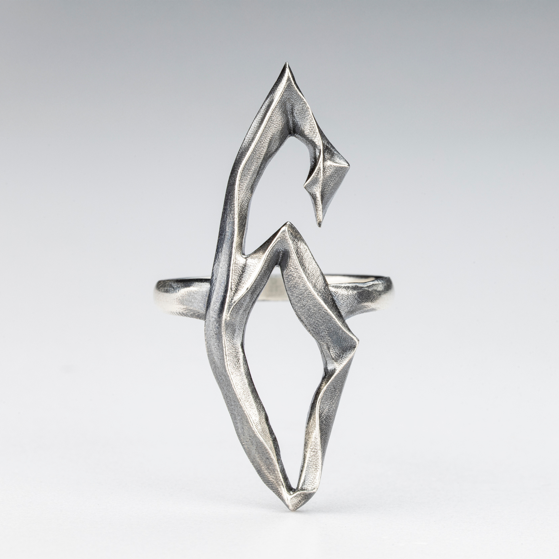 Angled view of the 6 Ring highlighting its raw, architectural texture.