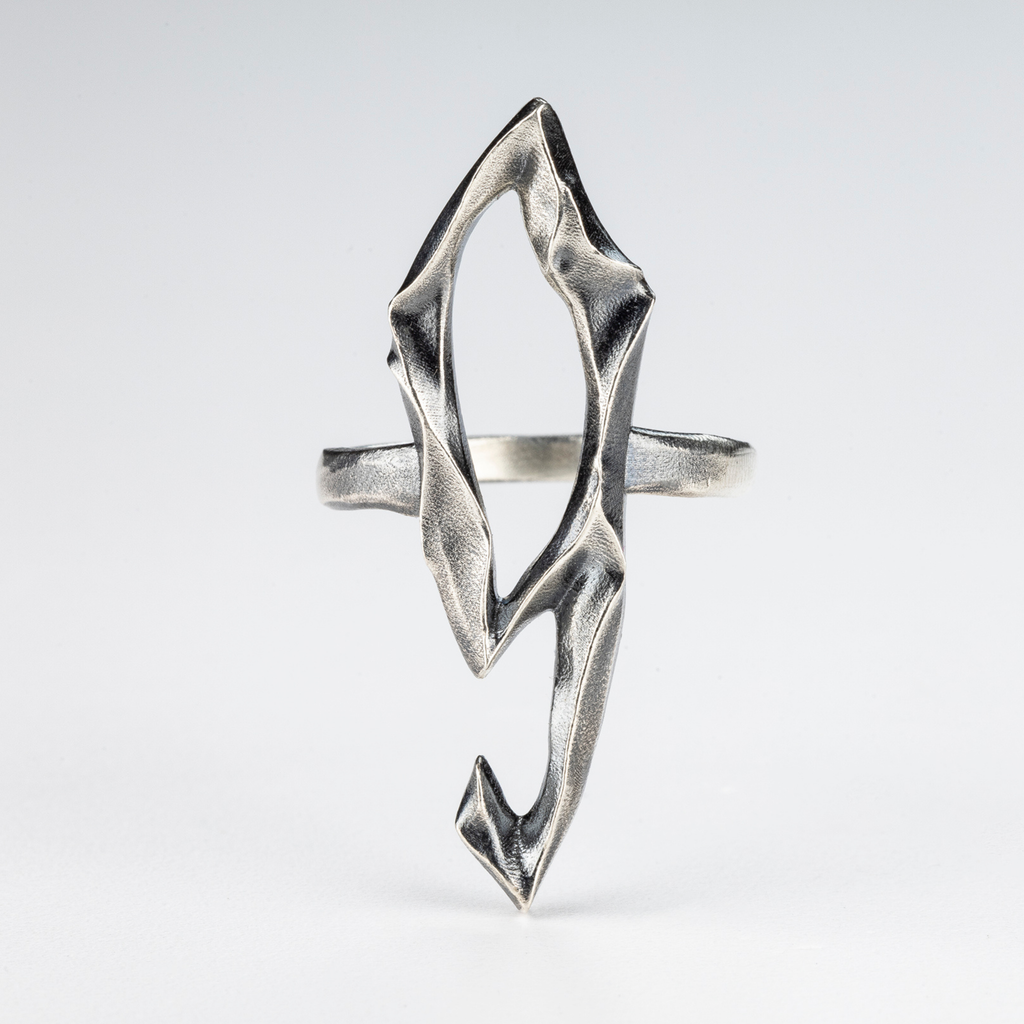 Handcrafted silver 9 Ring in gothic sculptural design, front view.