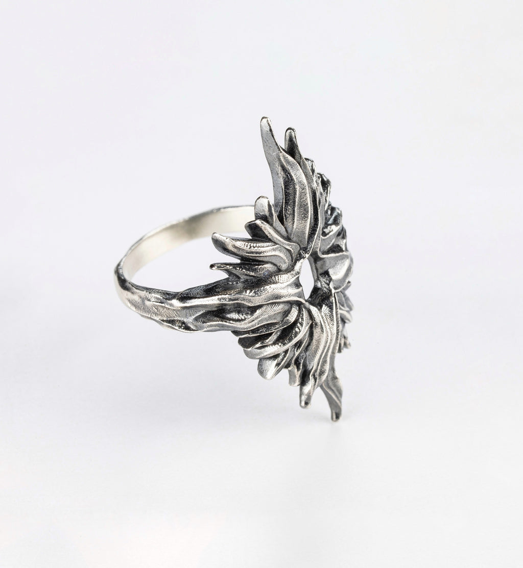 Side profile of the Dusk Sun silver ring by Sebamakes showing the smooth band structure blending into the top design