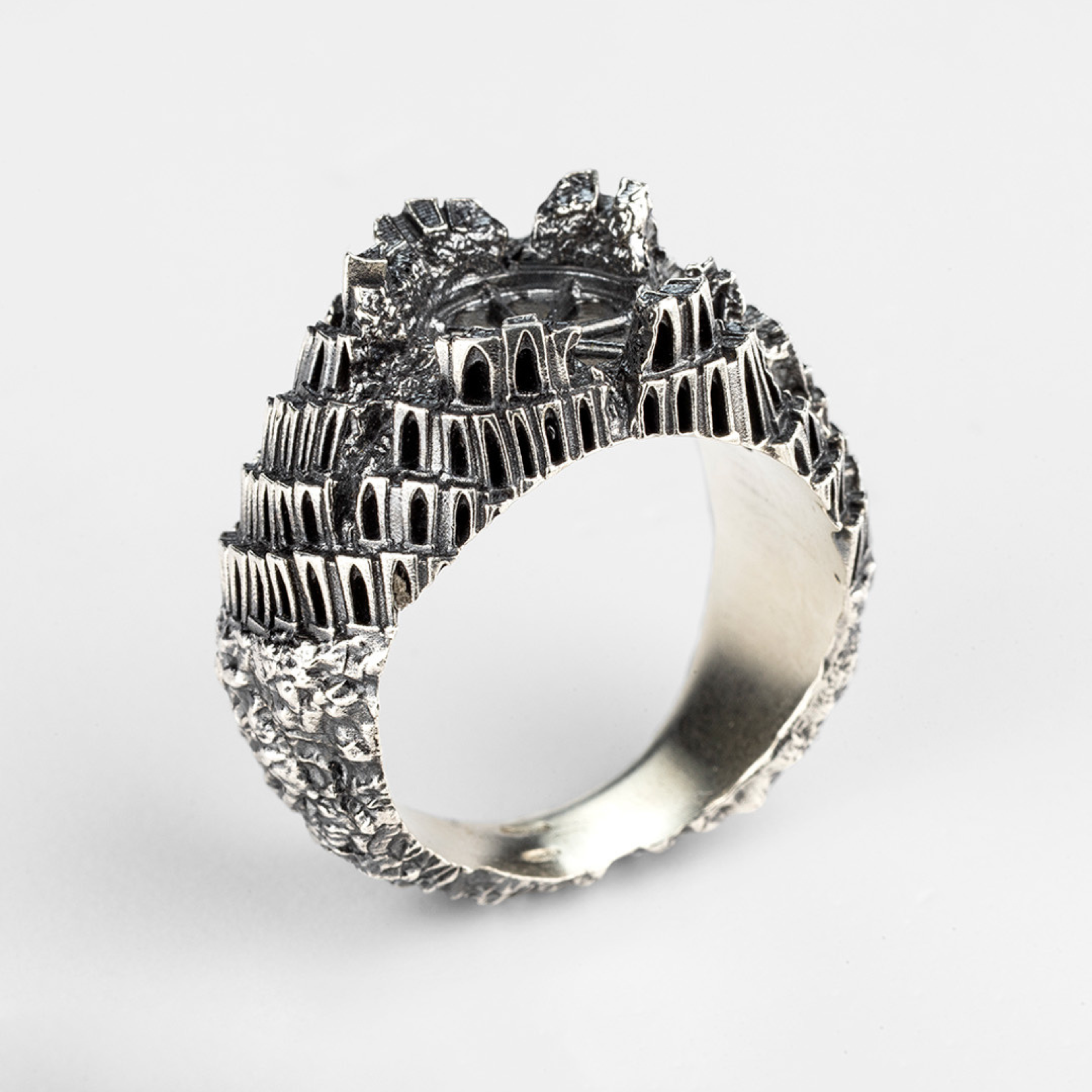 Back view of the "Babel" silver ring, showcasing the continuous textured surface of this wearable sculpture by Sebamakes.