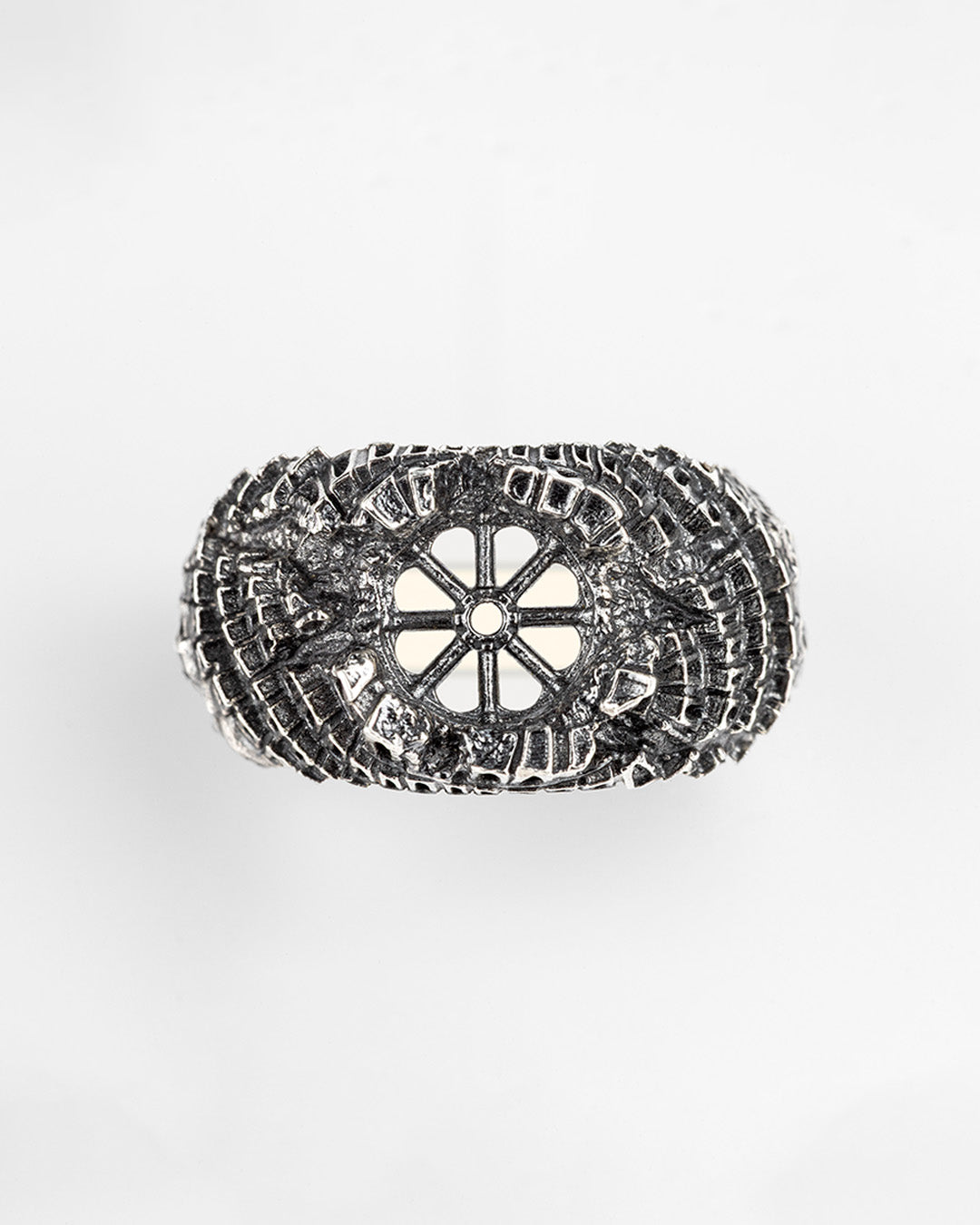 Back texture of Babel Ring, handmade silver brutalist ring with oxidized finish and architectural erosion details.
