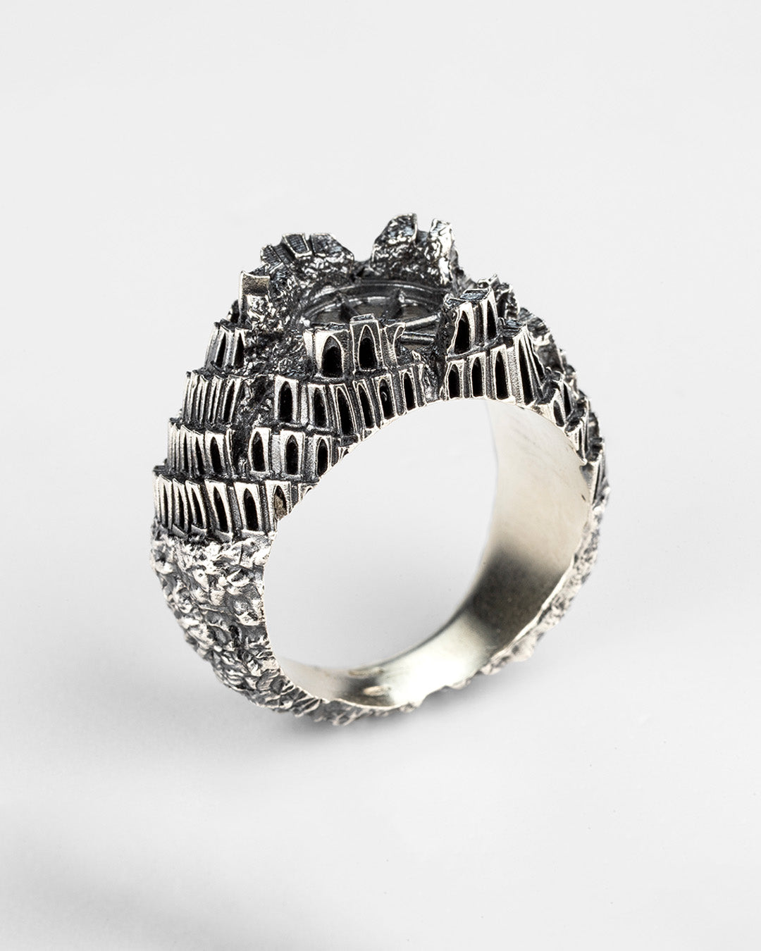 Oblique angle of Babel Ring, silver gothic brutalist jewelry design crafted in Italy by Sebamakes.

