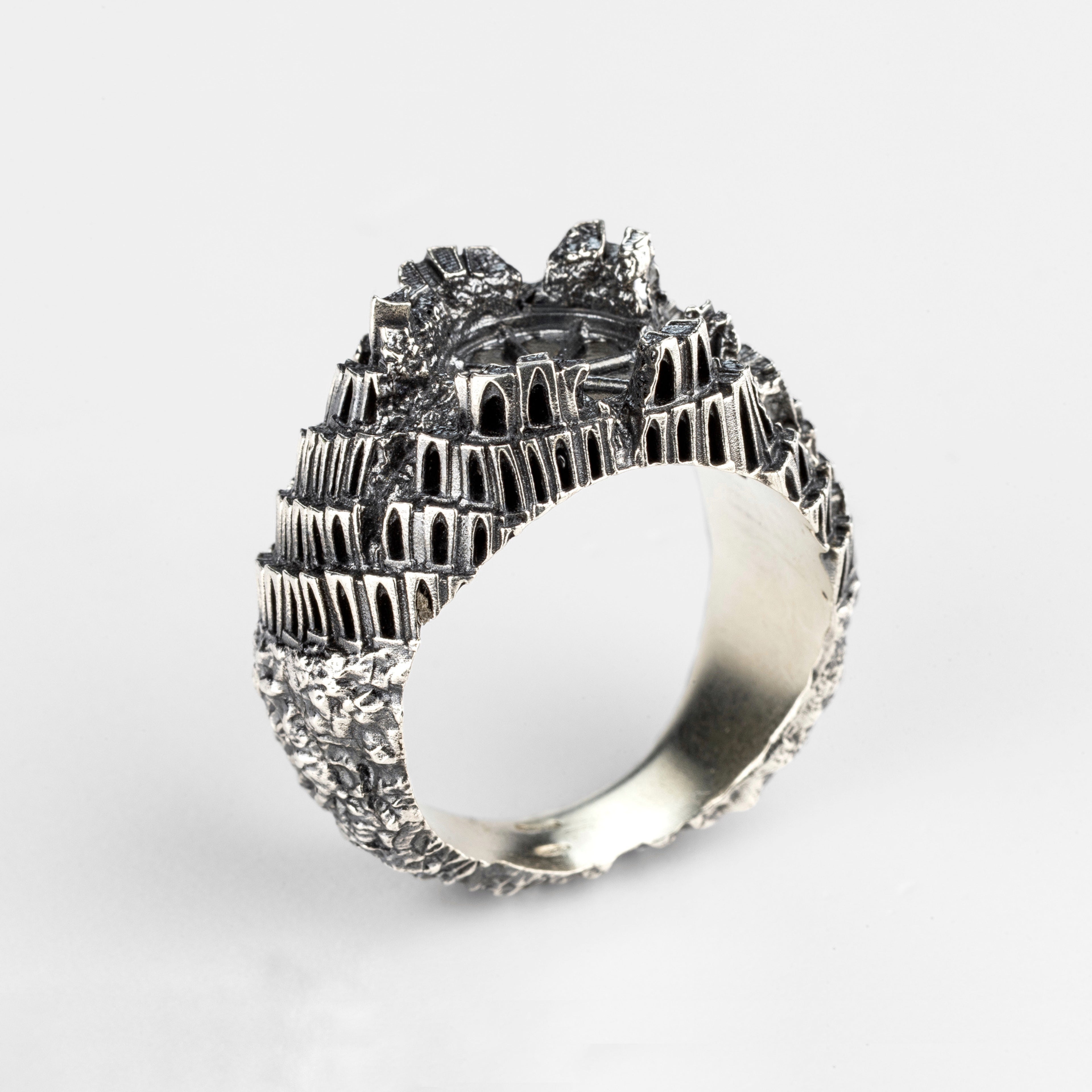 Main view of the "Babel" silver ring by Seba Makes, featuring a multi-level architectural design inspired by the Tower of Babel.