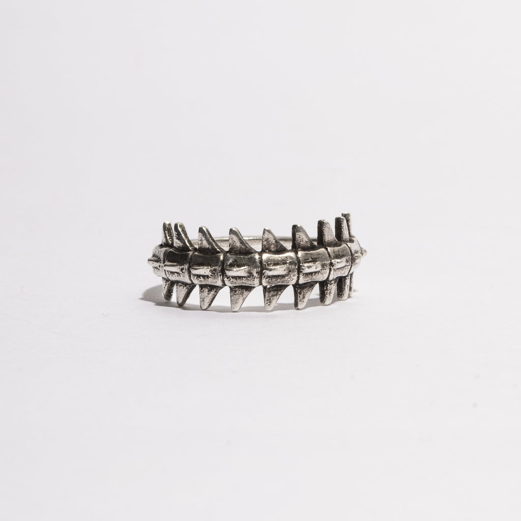 Side view of the Backbone Ring in sterling silver by Sebamakes, showing anatomical spine-inspired design and handcrafted texture.