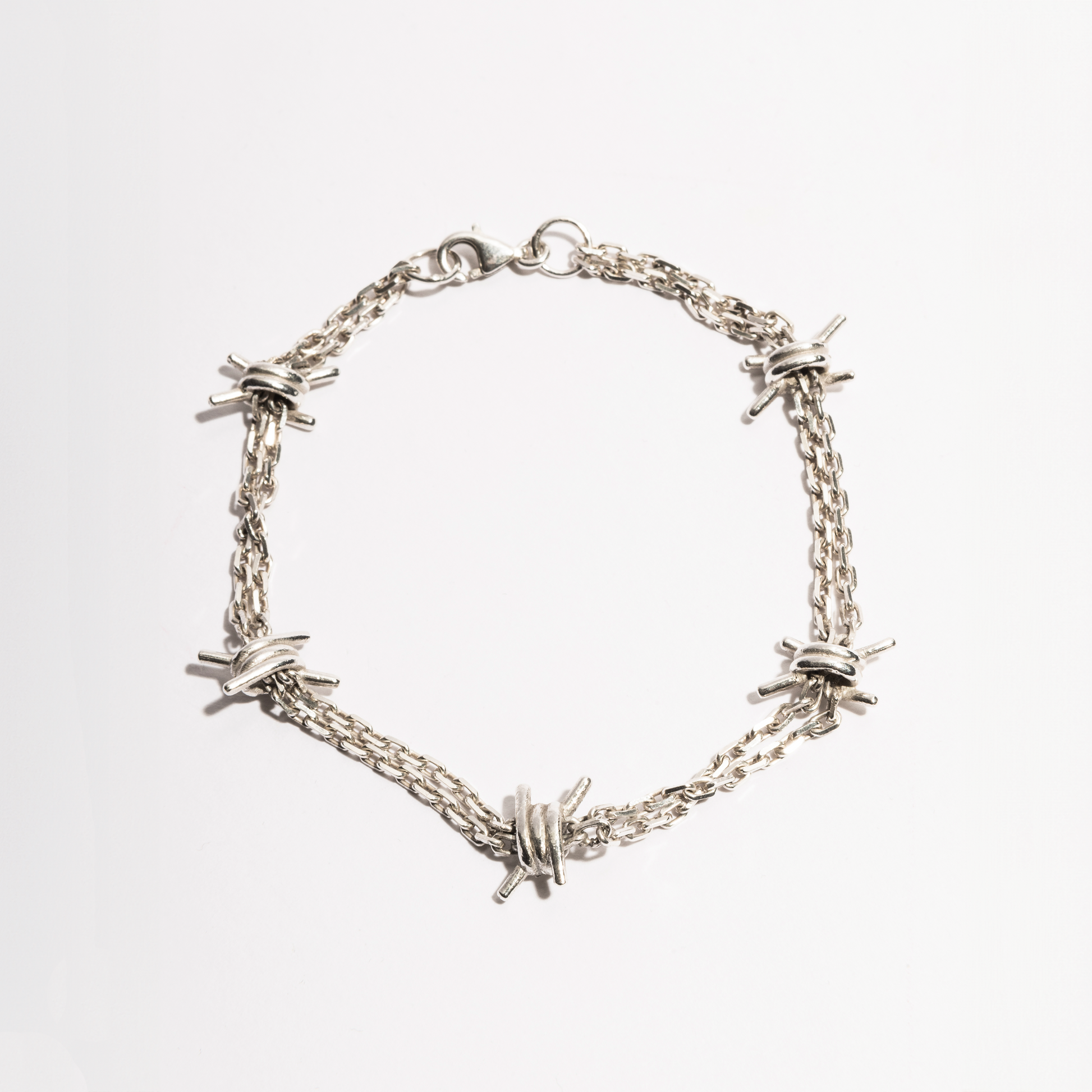 Barbwire Bracelet by Sebamakes, handcrafted sterling silver bracelet inspired by barbed wire, featuring detailed spikes and an industrial minimal design, made in Italy.