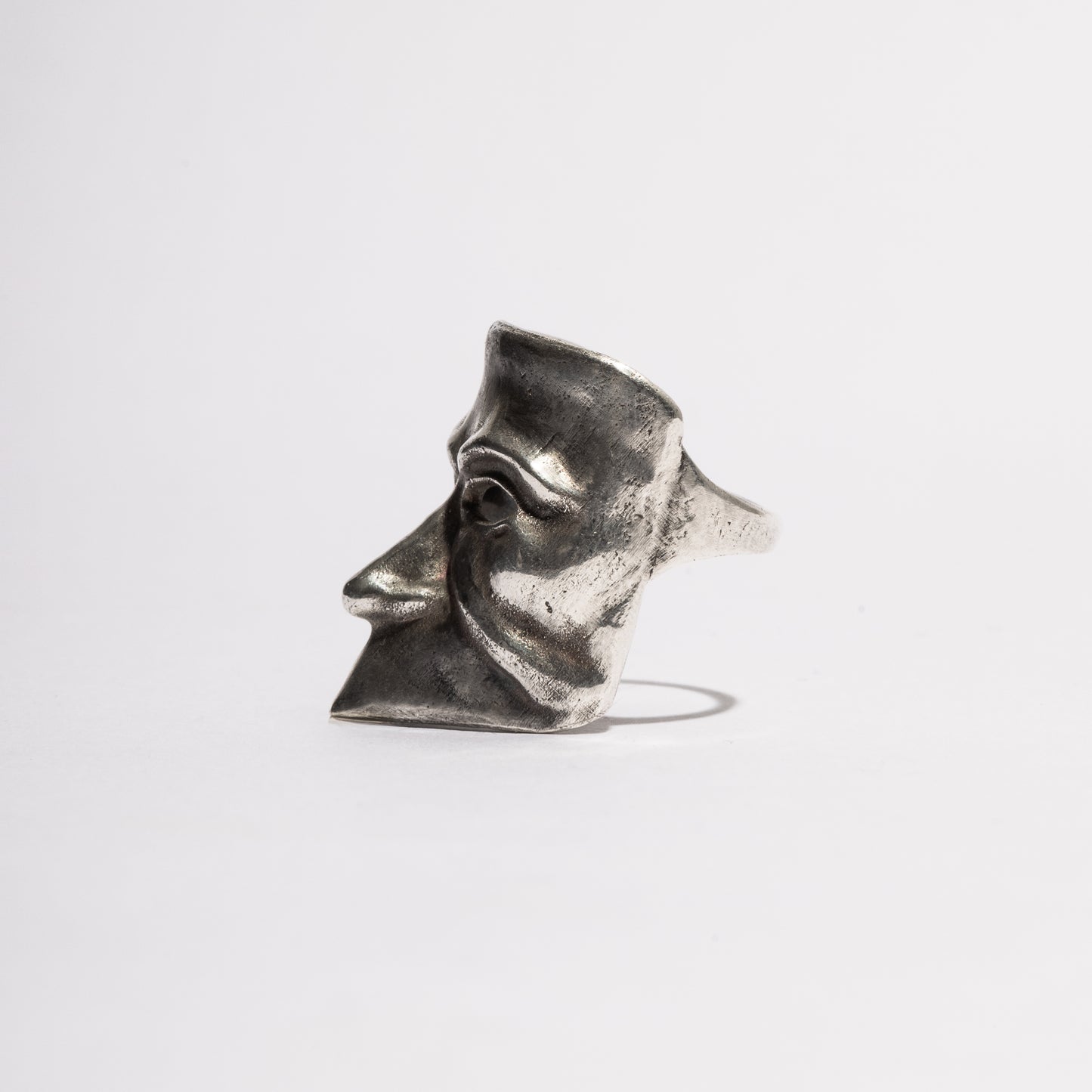 Side view of the Beuta Ring in sterling silver, handcrafted Venetian mask ring by Sebamakes with gothic sculptural form.