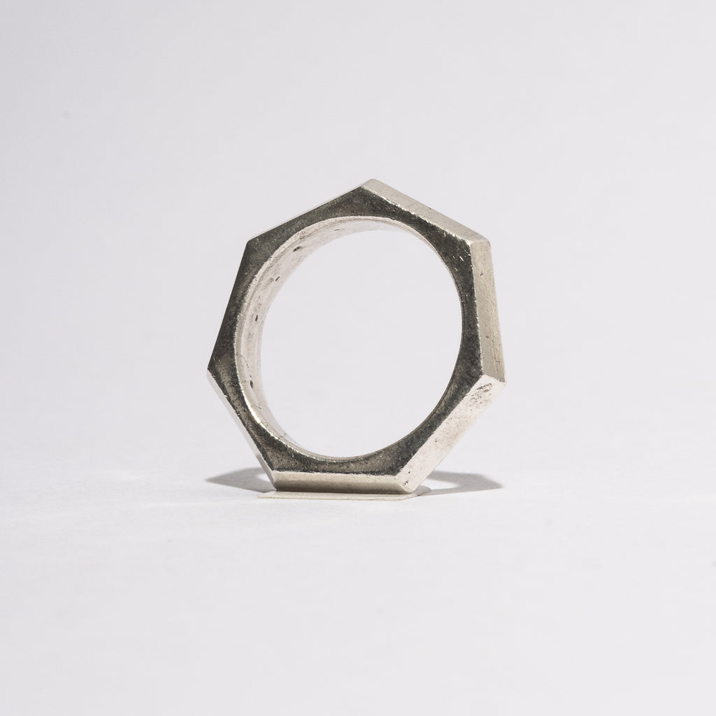 Front view of the Bolt Silver Ring in sterling silver, showing the hexagonal handcrafted structure inspired by mechanical forms, Sebamakes design.