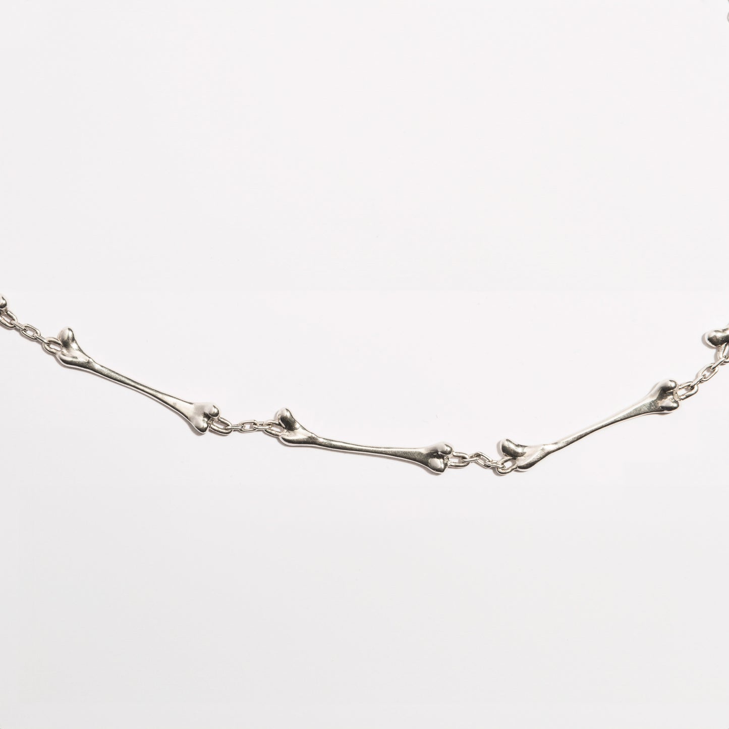 Detailed view of the Bone Necklace by Sebamakes, handcrafted sterling silver jewelry inspired by organic bone forms, made in Italy.