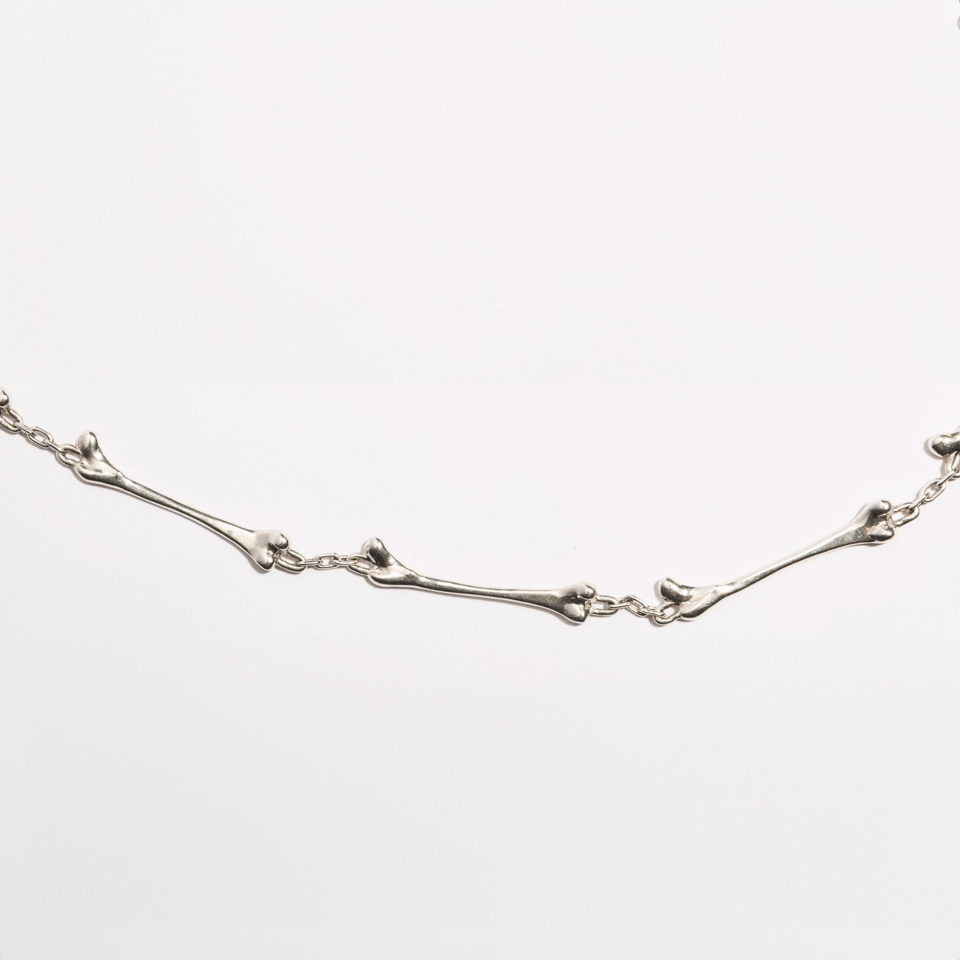 Detailed view of the Bone Necklace by Sebamakes, handcrafted sterling silver jewelry inspired by organic bone forms, made in Italy.