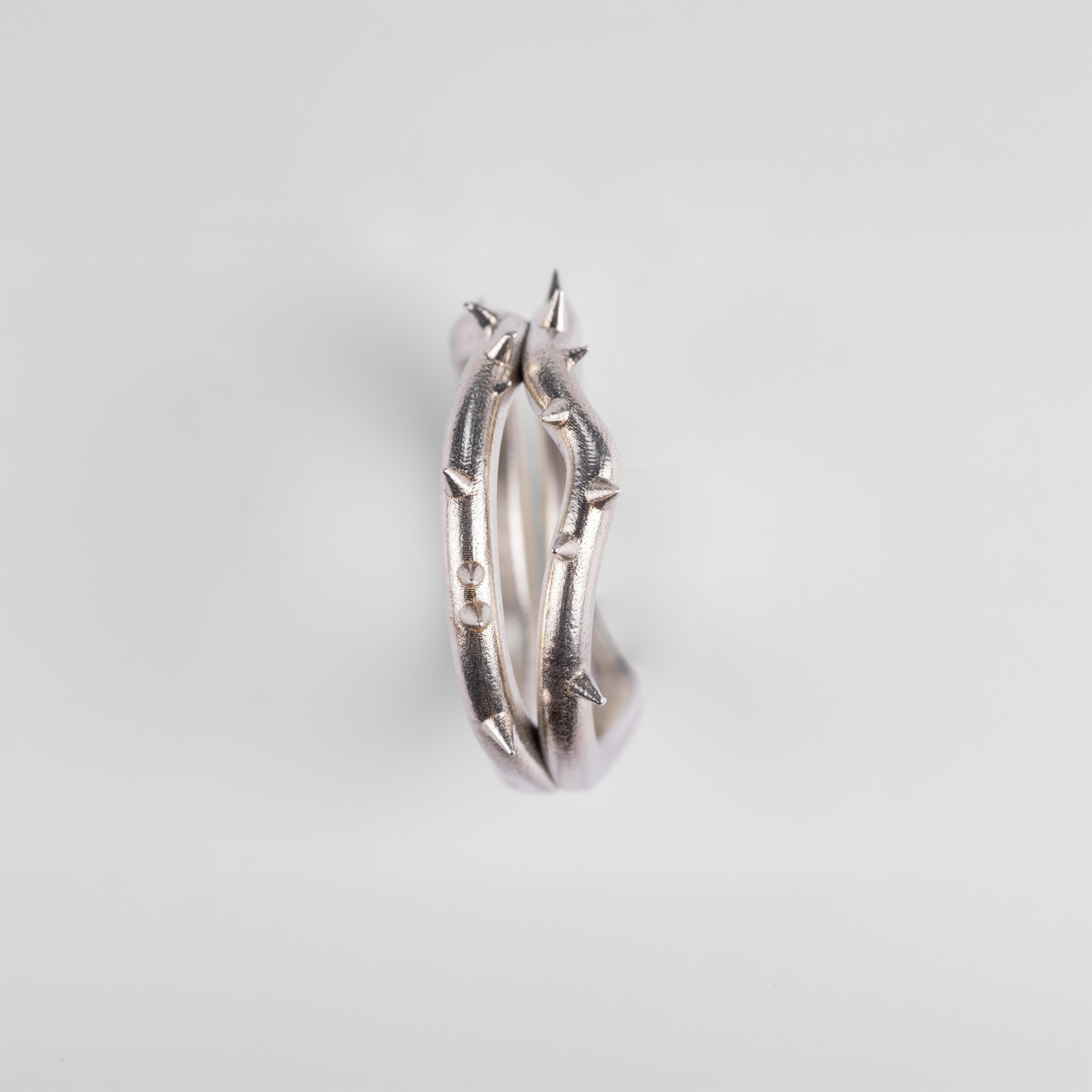 Side profile of the "Brambles" silver ring by Seba Makes, displaying the unique placement of the hand-modeled thorns along the band.