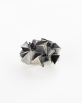 Top view of the multi-layered architectural structure of the handmade 925 silver Cestia Ring.