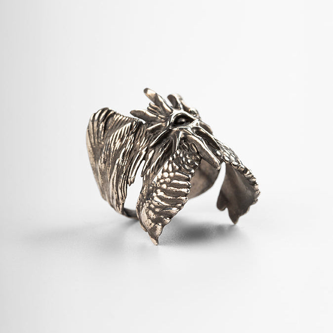 Close-up detail of the Cherub Ring's hand-carved texture