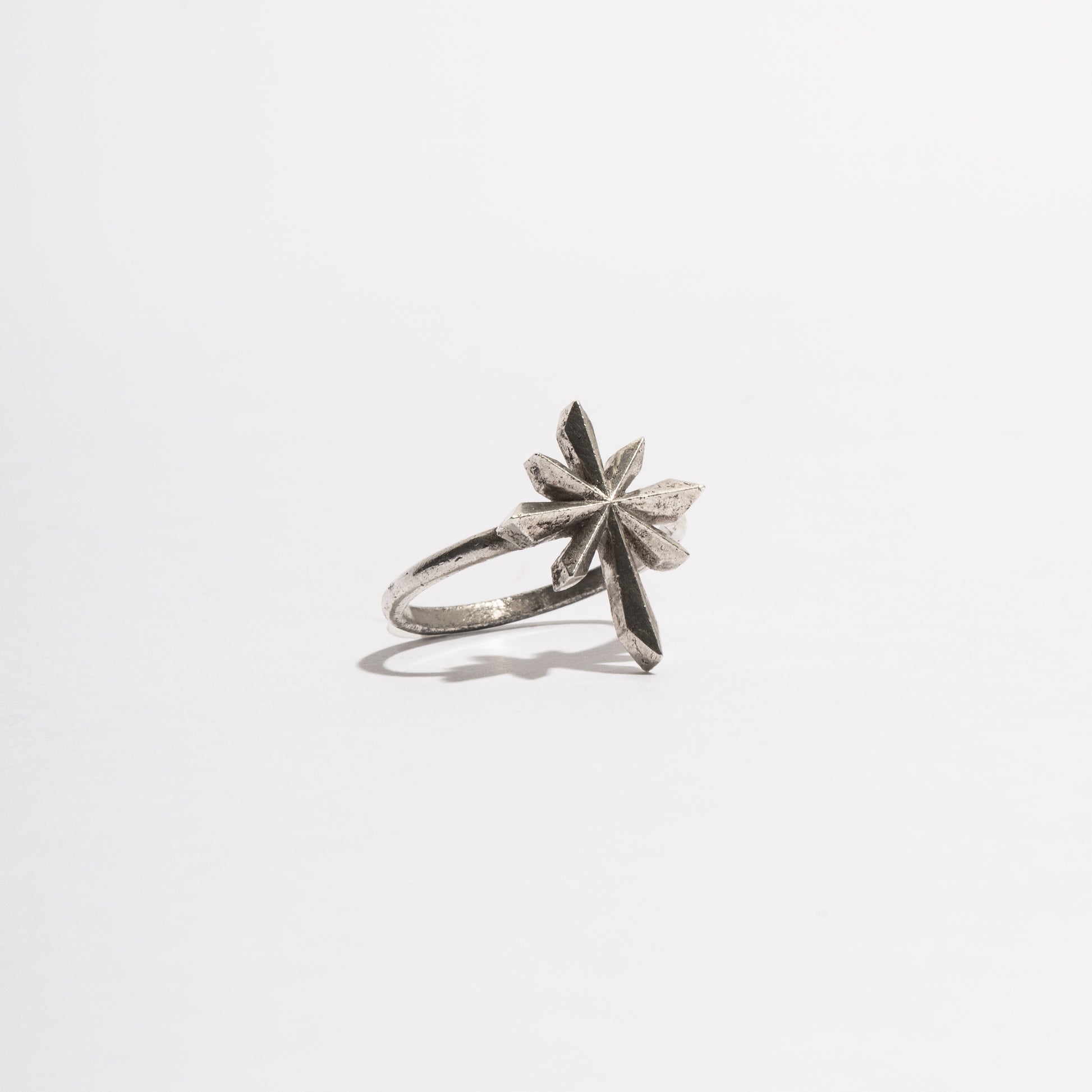 Side view of the Comet Ring by Sebamakes, handcrafted in sterling silver with bold angular lines inspired by the trajectory of a comet.