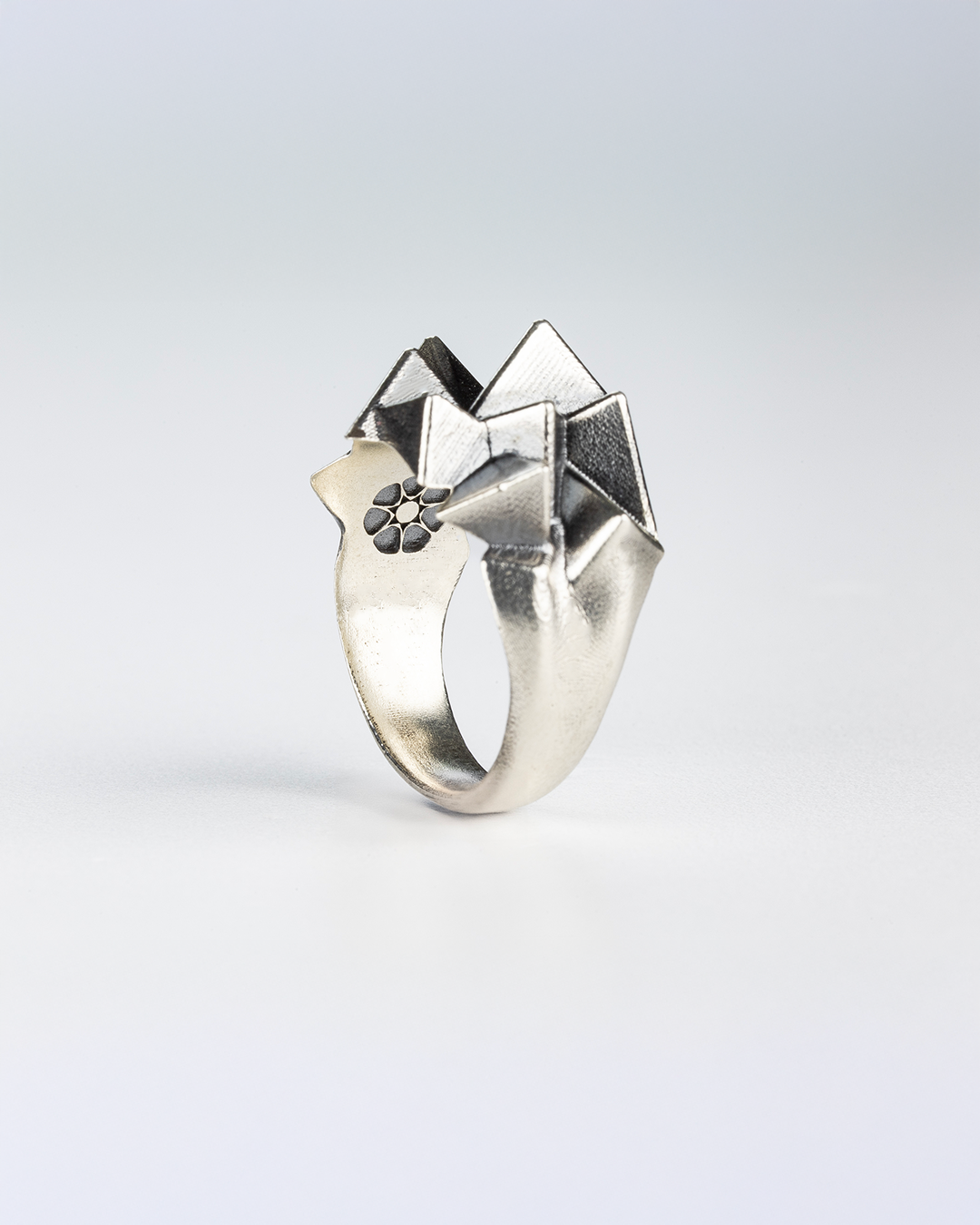 Close-up detail of the hand-burnished finish on the 925 silver Cestia Ring.
