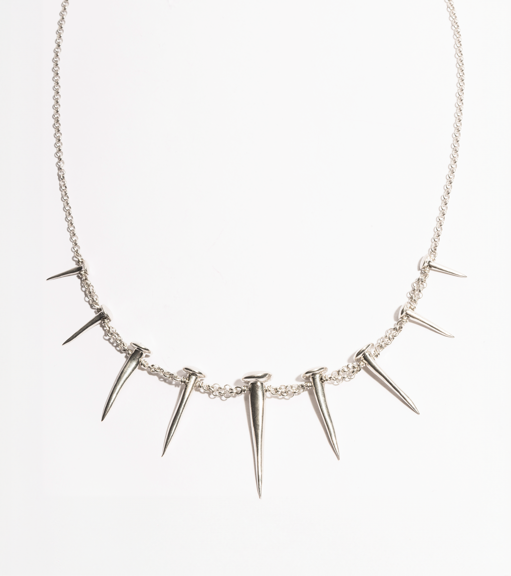 Front product view of the Nails Necklace by Sebamakes, sterling silver handcrafted necklace featuring nail-inspired spikes in sculptural arrangement.