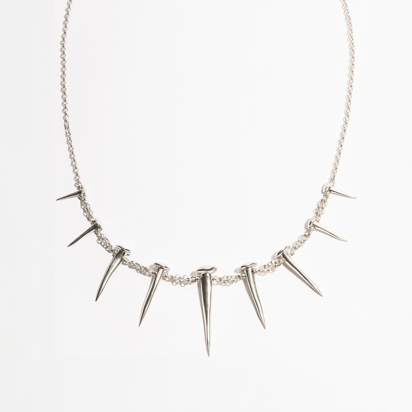 Front product view of the Nails Necklace by Sebamakes, sterling silver handcrafted necklace featuring nail-inspired spikes in sculptural arrangement.