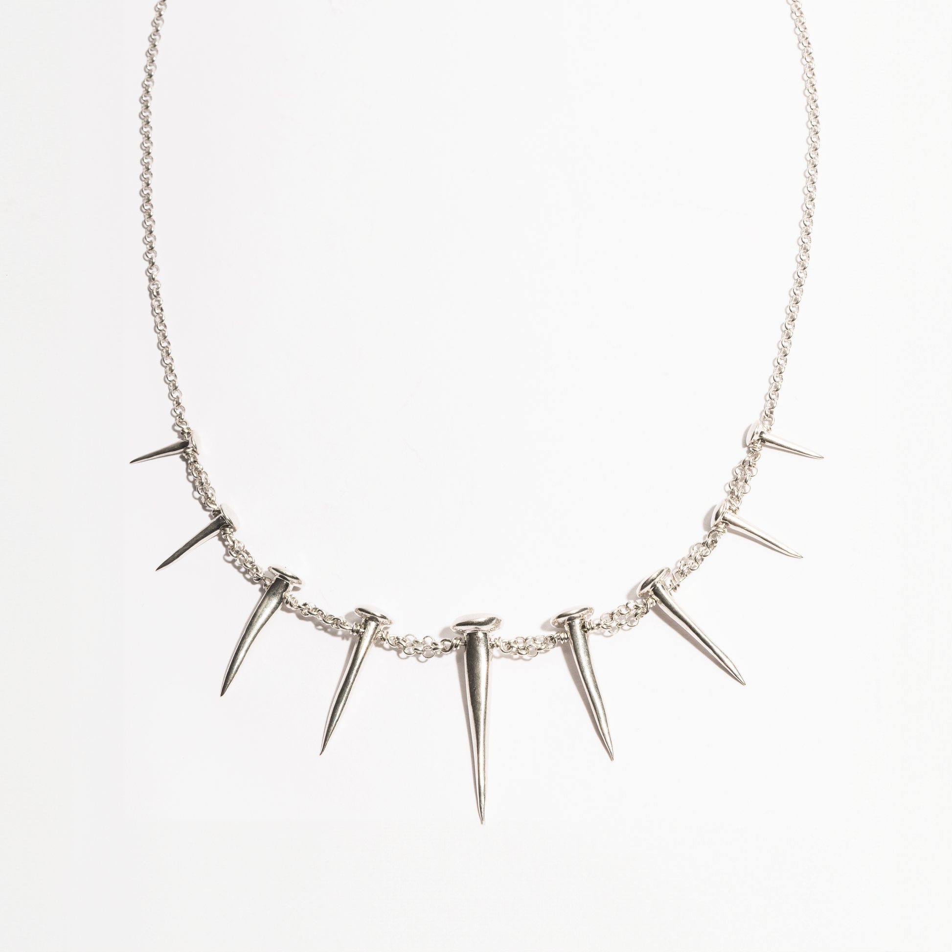 Front product view of the Nails Necklace by Sebamakes, sterling silver handcrafted necklace featuring nail-inspired spikes in sculptural arrangement.