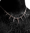 Close-up worn view of the Nails Necklace by Sebamakes, handcrafted sterling silver statement necklace inspired by industrial spikes and minimalist sculpture.