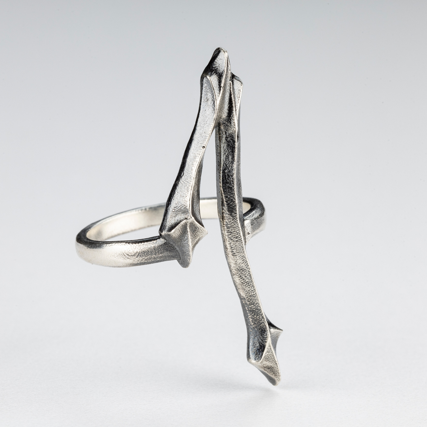 Detail view of the One Ring showing its handcrafted gothic and brutalist silver structure