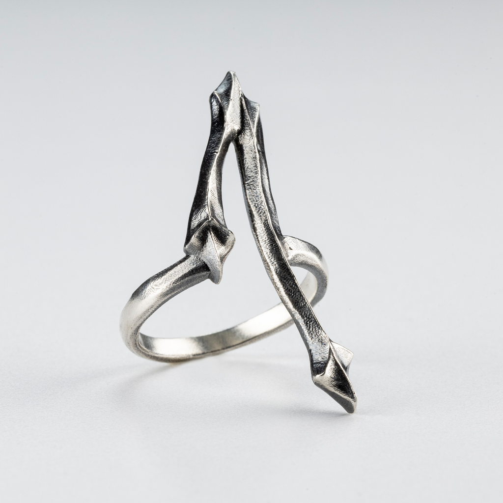Side view of the One Ring showing its brutalist gothic structure in sterling silver.