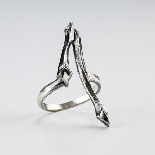 Side view of the One Ring showing its brutalist gothic structure in sterling silver.