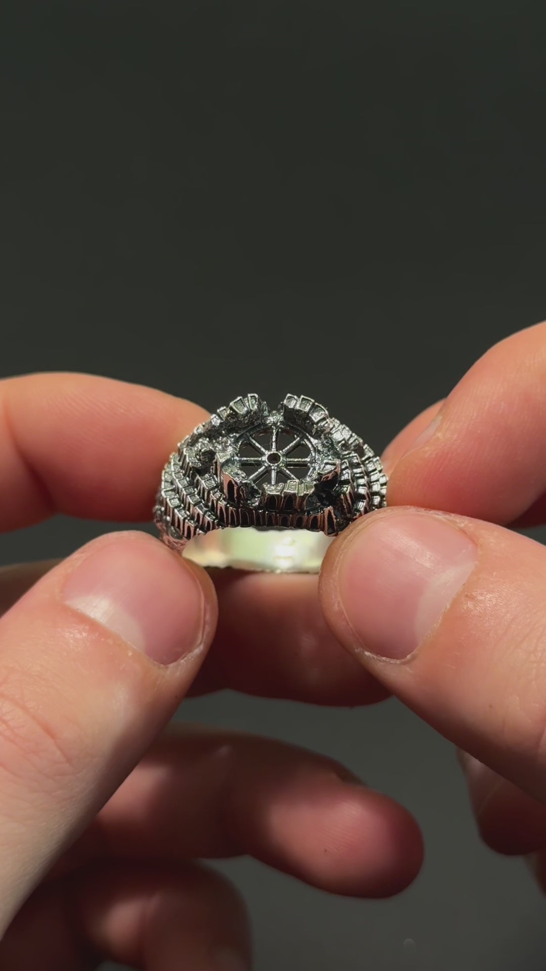 Demonstration video of the "Babel" silver ring held in hands, revealing the 3D architectural details and real-life scale of the Seba Makes design.