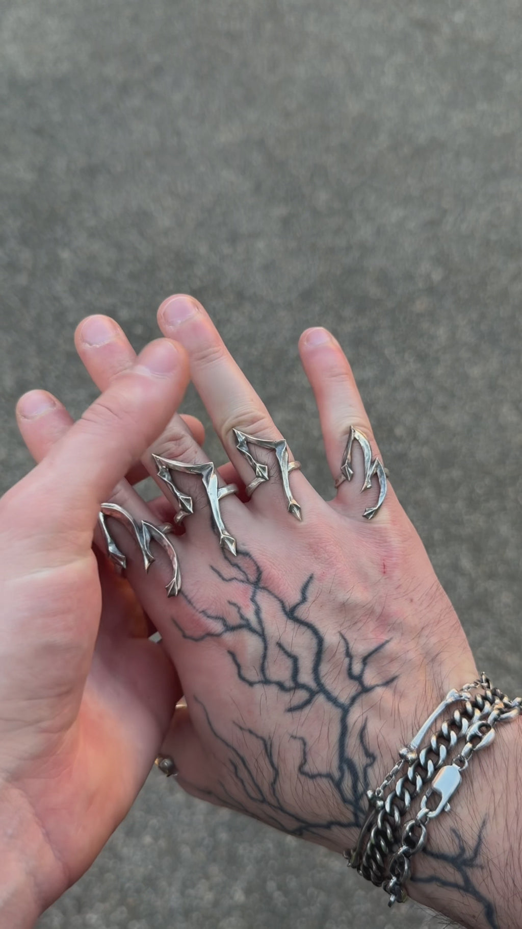 Demonstration video showing hands wearing multiple silver number rings from the Seba Makes 09 Collection, highlighting their details, movement, and real-life proportions.