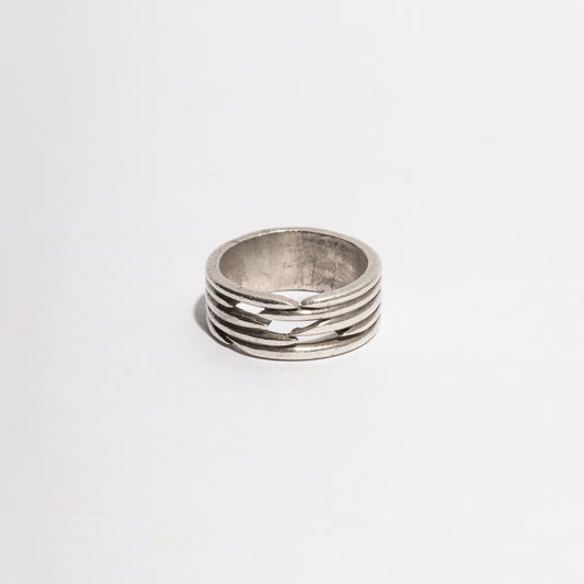 Puncture Ring by Sebamakes, handcrafted sterling silver ring with architectural openings and sculptural minimal design, made in Italy.