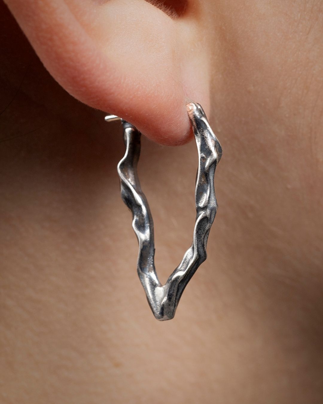 Long Ridge drop earrings worn on the earlobe, showcasing the vertical line and fit.