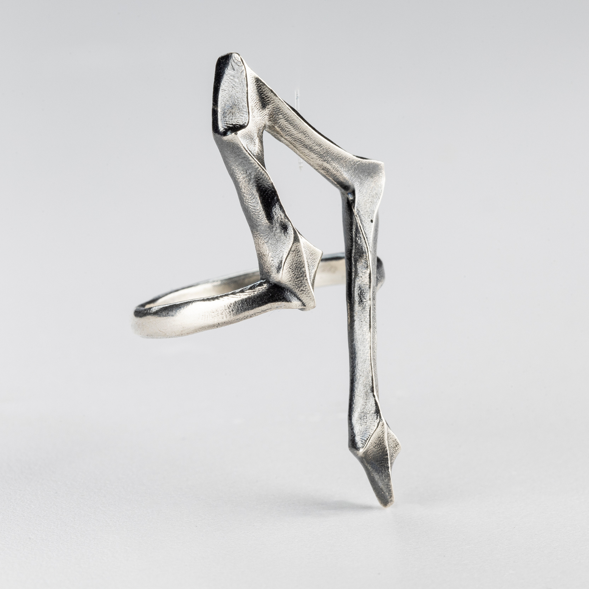 7 Ring by Sebamakes – brutalist silver ring with angular handmade design, perspective view.
