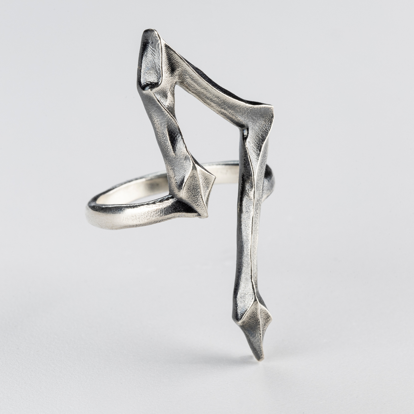 7 Ring by Sebamakes – artisanal 925 silver ring with elongated gothic structure, side angle.