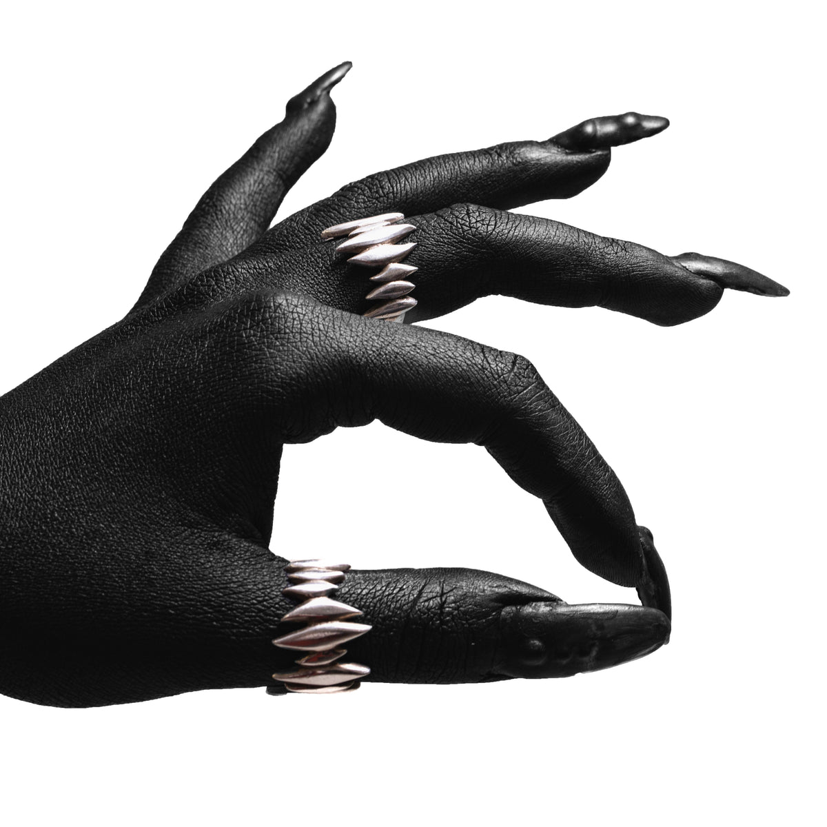 Sterling silver Splinter Ring worn on black painted fingers with long nails.