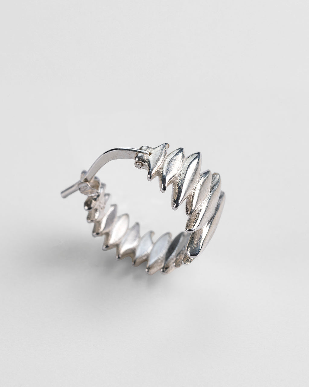  Front and profile view of the handmade Splinters hoop earrings.