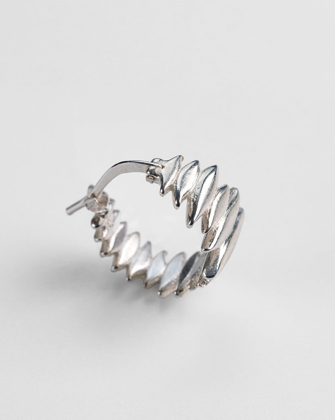  Front and profile view of the handmade Splinters hoop earrings.