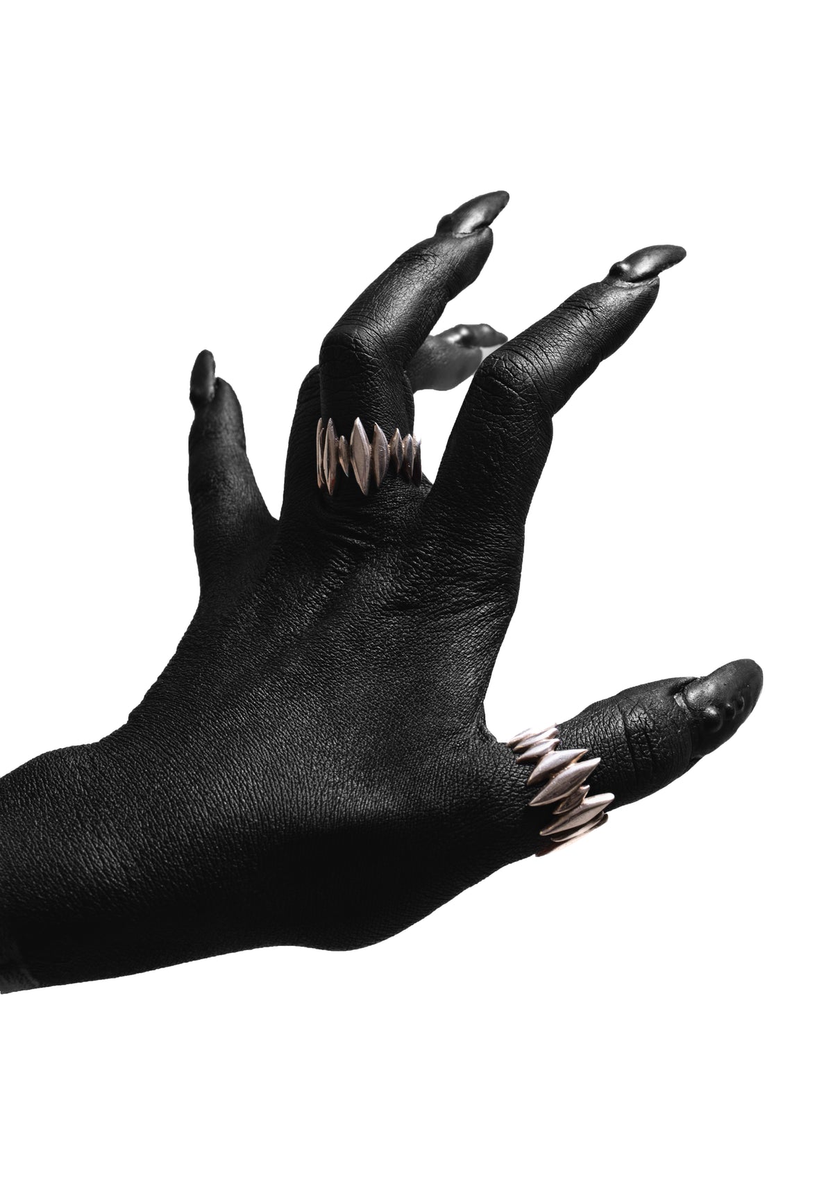 Hand wearing multiple silver Splinter Rings by Sebamakes.
