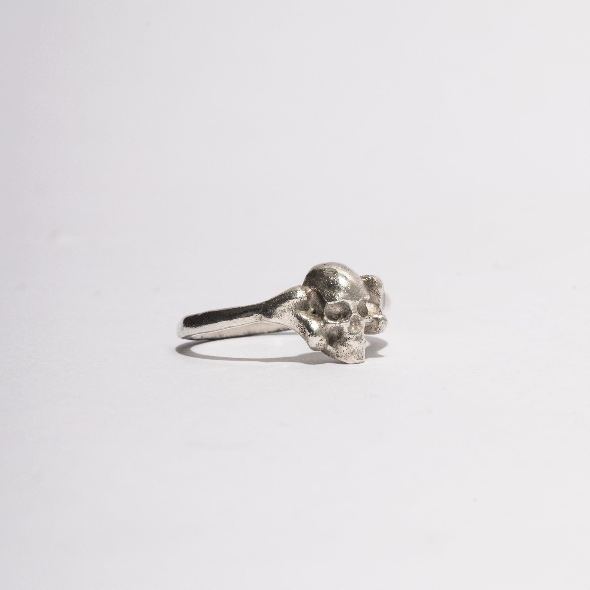 Close-up of the Silver Skull Ring showing detailed handcrafted sterling silver skull texture, sculptural gothic jewelry by Sebamakes.