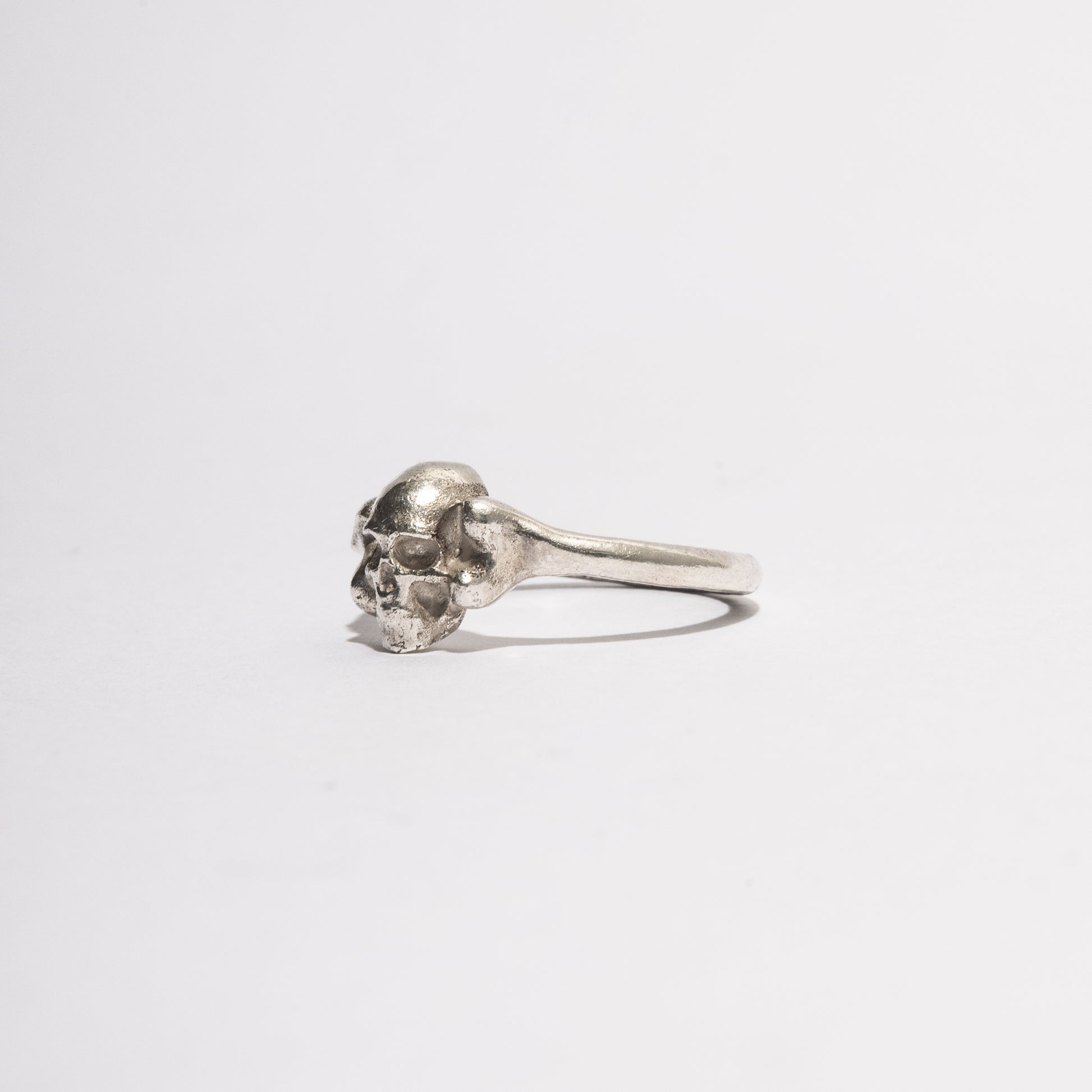 Side view of the Silver Skull Ring in sterling silver, handcrafted gothic jewelry by Sebamakes with detailed skull design.