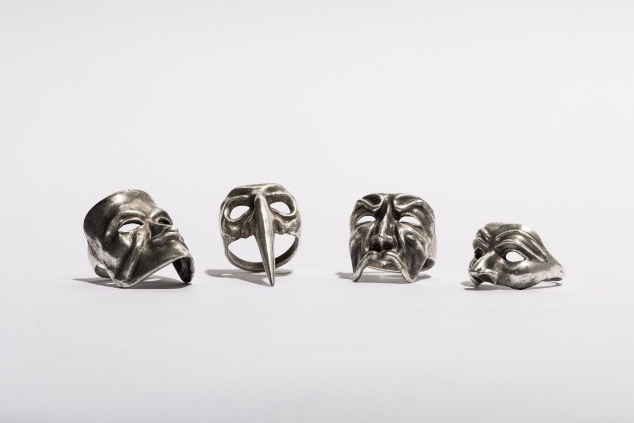Close-up of Sebamakes Carnival Mask Rings showing handcrafted sterling silver Venetian masks with sculptural detail and gothic design.